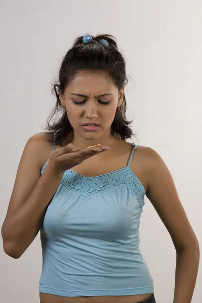 Woman looking at pills — Stock Photo, Image