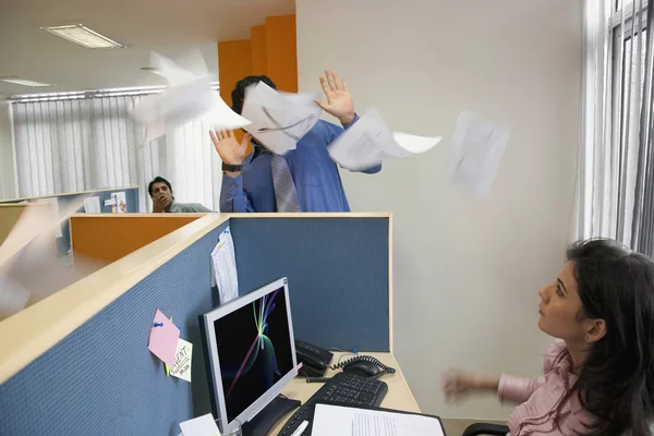 Papers flying around in an office — Stock Photo, Image