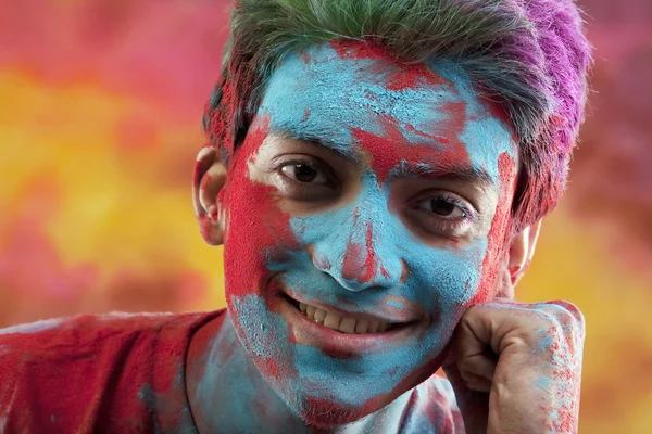 Man's face covered in holi colours — Stock Photo, Image
