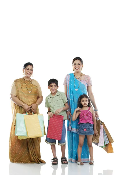 Family with shopping bags — Stock Photo, Image