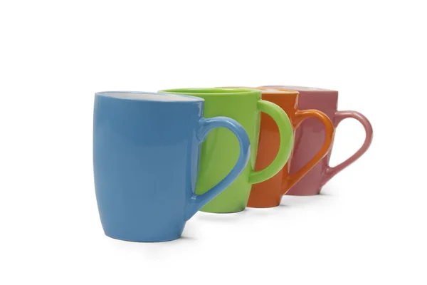 Colourful mugs in a row — Stock Photo, Image