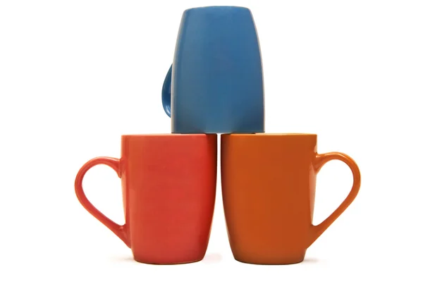 Tazas de colores en una fila — Foto de Stock