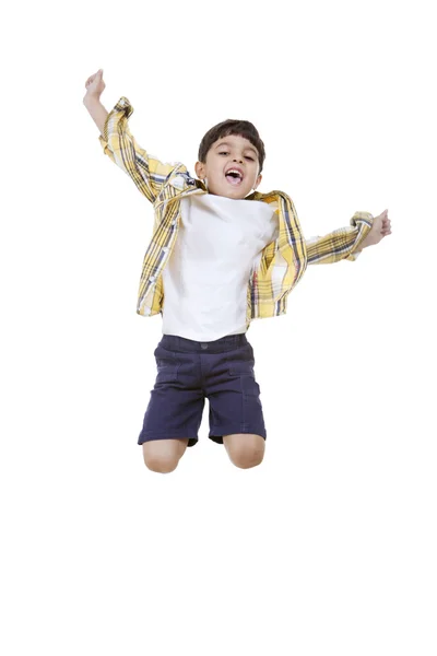 Szczęśliwy chłopiec skoki — Zdjęcie stockowe