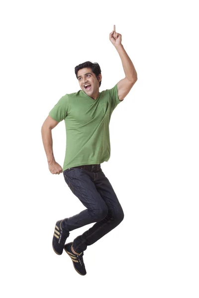 Handsome young guy jumping — Stock Photo, Image