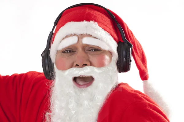 Papai Noel ouvindo música — Fotografia de Stock