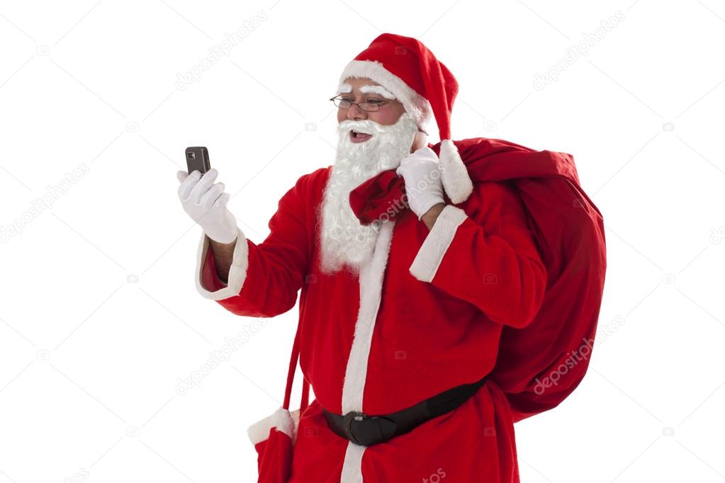 pre nol avec tlphone portable tout en transportant le sac de nol prsente image de iphemant - Telephone Pere Noel pre nol avec tlphone portable tout en transportant le sac de nol prsente image de iphemant - Telephone Pere Noel