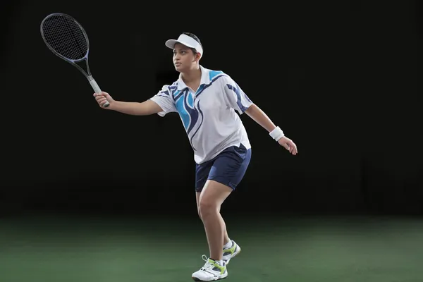 Young woman  playing tennis — Stock Photo, Image
