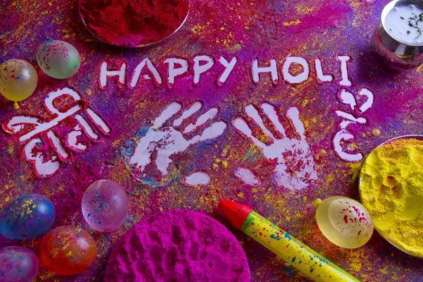Impressões digitais com texto Happy Holi escrito em rangoli — Fotografia de Stock