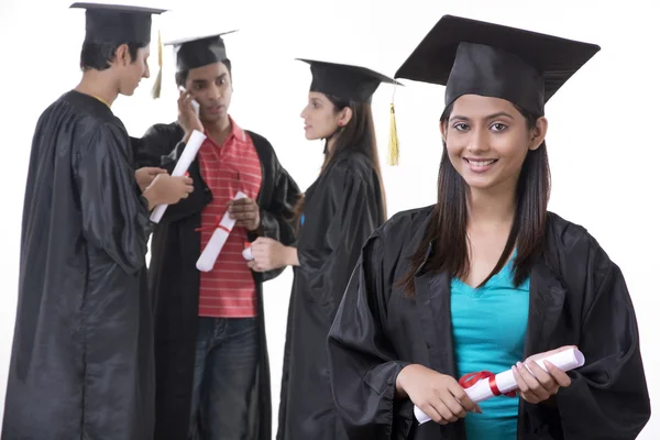 Graduate student with friends — Stock Photo, Image