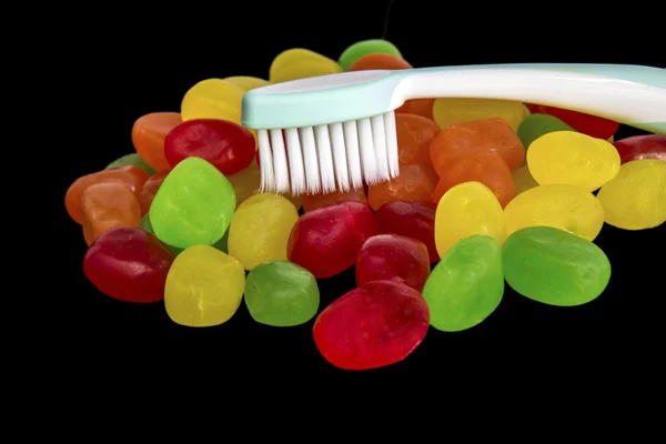 ขนมที่มีแปรงสีฟัน — ภาพถ่ายสต็อก