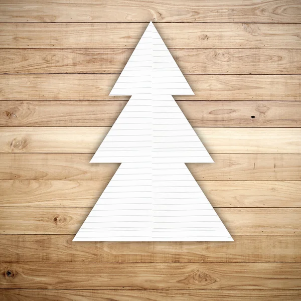 Boże Narodzenie drzewo papier firmowy na brązowy deski drewniane ściany tekstura tło — Zdjęcie stockowe