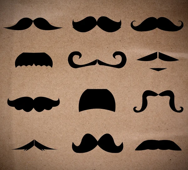 Set of mustaches isolated on recycle paper background. — Stock Photo, Image