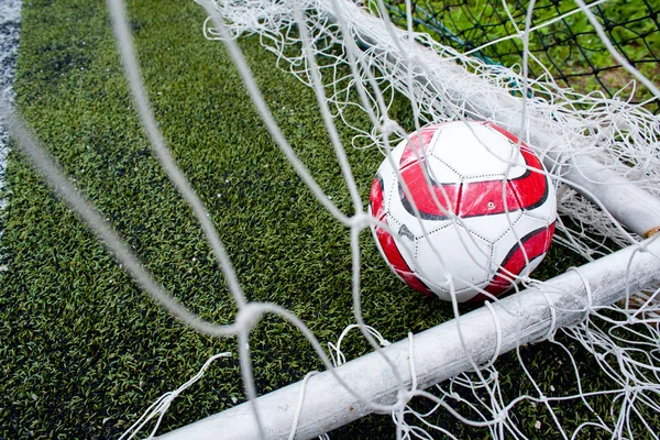 Football in the goal net — Stock Photo, Image