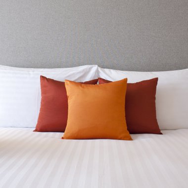 Colorful Pillow on hotel bed with space for text