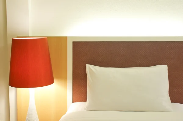 Pillow and Bed in a hotel room at night — Stock Photo, Image