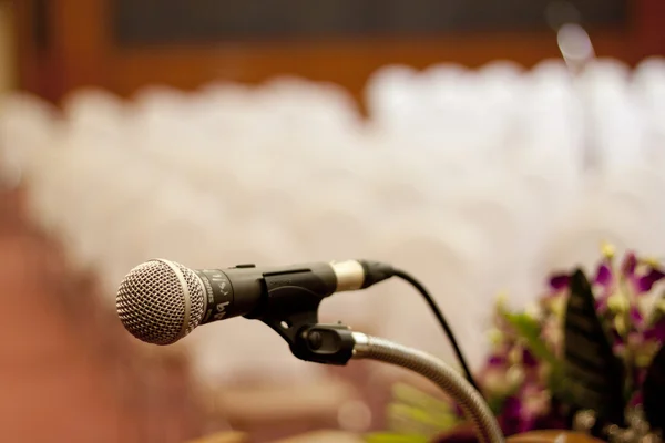 Close up of microphone in concert hall or conference room — Stock Photo, Image