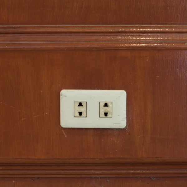 Power outlet on wooden wall. — Stock Photo, Image