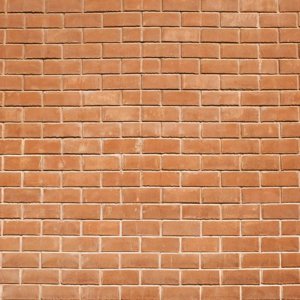 Una pared de ladrillo rojo para textura de fondo — Foto de Stock