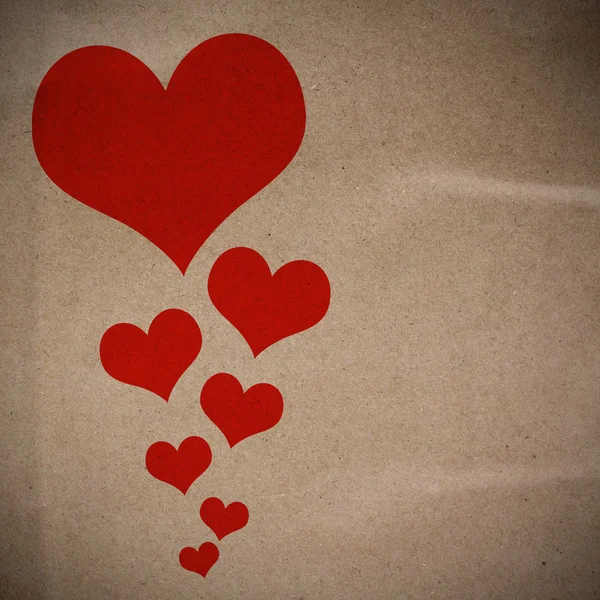 Geri dönüşüm kağıt doku arka plan üzerinde kalp tasarımı — Stok fotoğraf