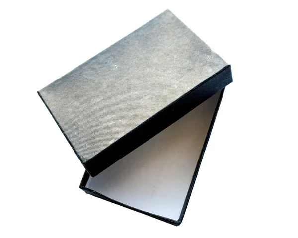 Caja negra en blanco sobre fondo aislado blanco — Foto de Stock