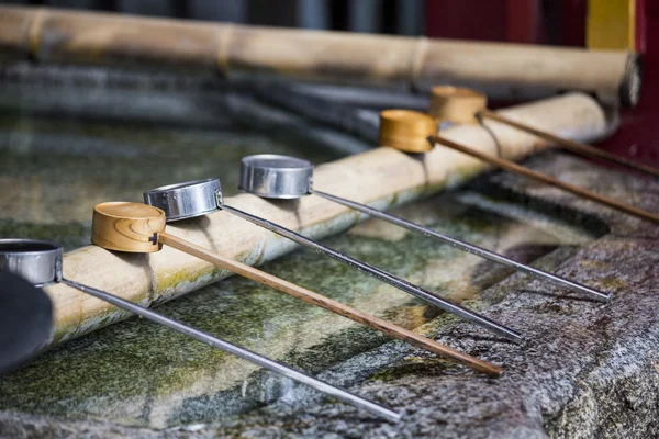 Water dipper on front of shrine — Stock Photo, Image