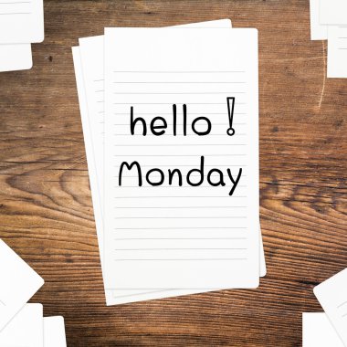 Hello Monday on paper and wood table desk clipart