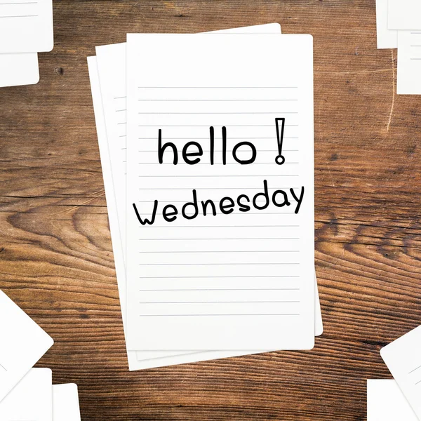 Hello Wednesday on paper and wood table desk — Stock Photo, Image