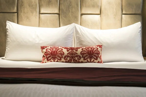 Bed in a hotel room at night — Stock Photo, Image