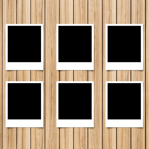 Polaroid photo frame on wood background — Stock Photo, Image