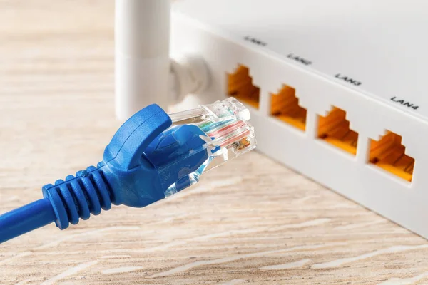 Blue Network Cable Plug Almost Inserted Yellow Socket White Wireless — Stock Photo, Image