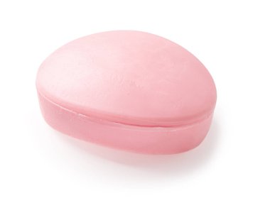 Beyaz arka planda izole edilmiş Oval şekilli pembe sabun kalıbı. Cilt bakımı ve vücut için elips çiçekli sabun kalıbı. El yıkama, saflık ve tuvalet malzemeleri. Üst görünüm.