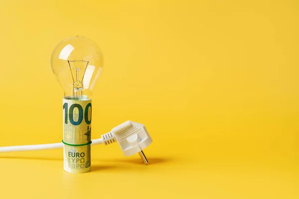 Light Bulb Rolled 100 Euro Banknotes White Power Plug Yellow — Stock Photo, Image