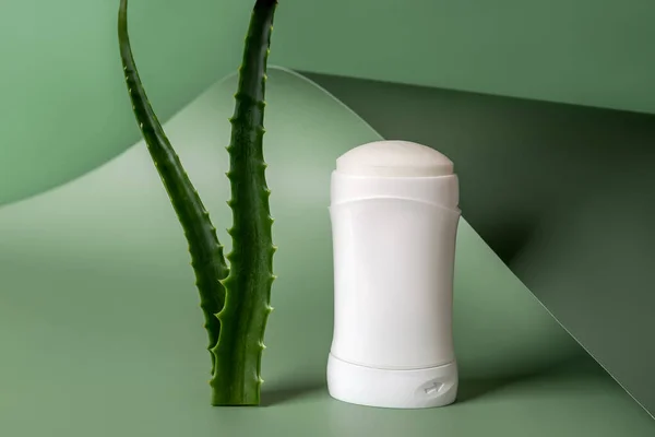 Solid Antiperspirant Deodorant Two Fresh Aloe Leaves Green Wavy Background — стоковое фото