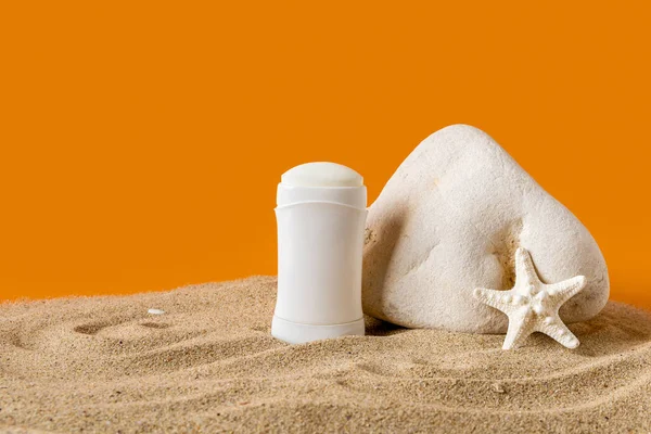 Solid Antiperspirant Deodorant Sea Star Stone Sand Orange Background Concept — Fotografia de Stock