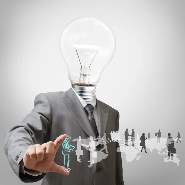 Businessman with light bulb head and employees — Stock Photo, Image