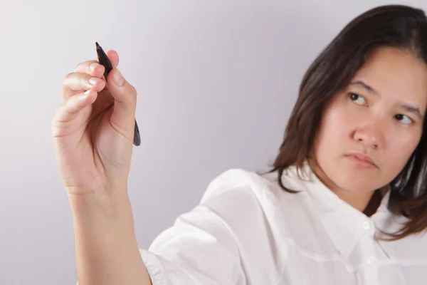 Young businesswoman with pen — Stock Photo, Image