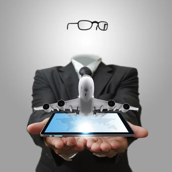 Invisible business man shows tablet computer with aircraft as co — Stock Photo, Image