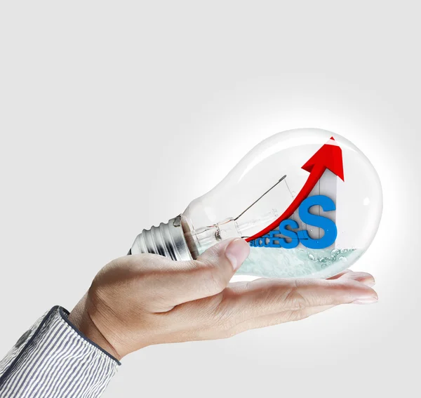 Hand show light bulb and graph — Stock Photo, Image