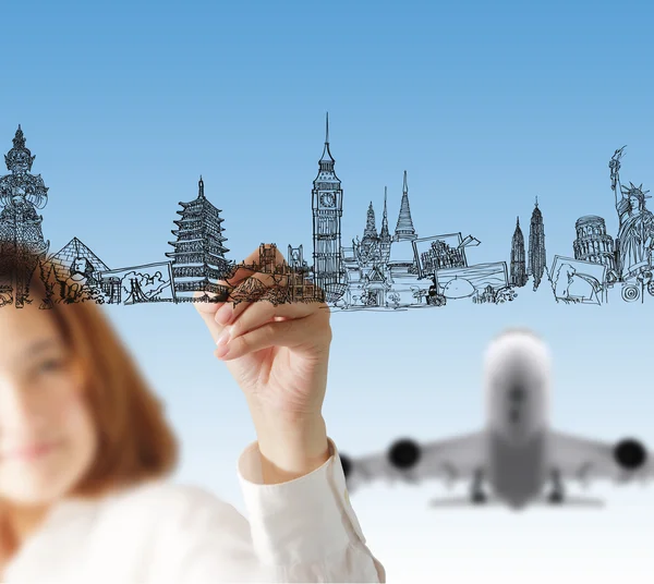 Female hand draws dream travel — Stock Photo, Image