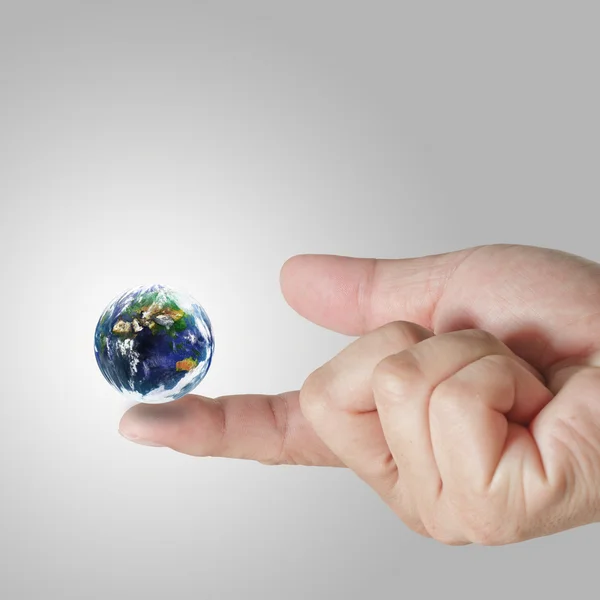 Earth globe on his finger — Stock Photo, Image