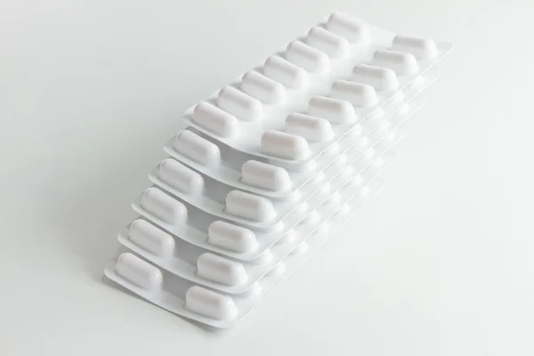 Συσκευασίες στοίβα από λευκό χάπια — Φωτογραφία Αρχείου
