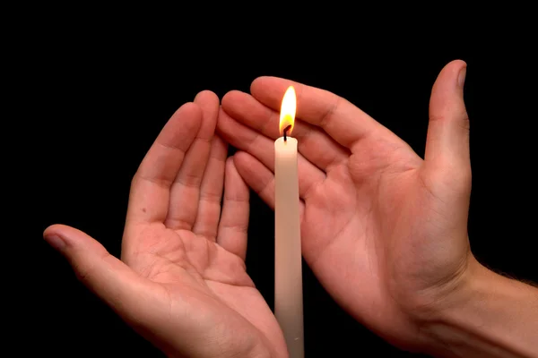 Hand near the candle — Stock Photo, Image