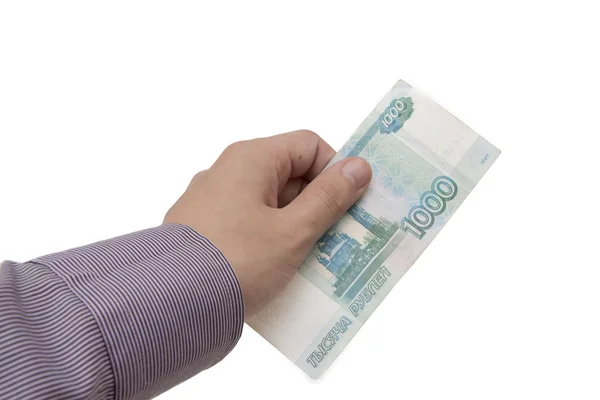 Hand hält eine Banknote von 1000 Rubel Stockbild