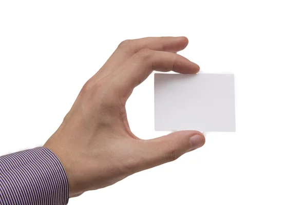 Die Hand eines Mannes mit einer weißen Visitenkarte Stockbild