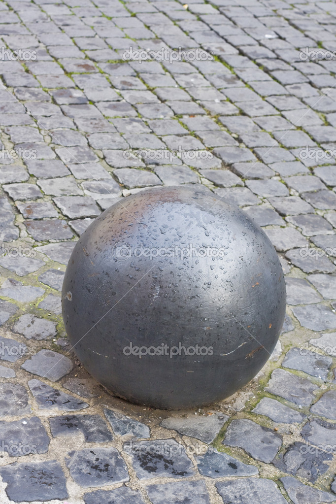 Iron ball on cobblestone — Stock Photo © commonn #14118931