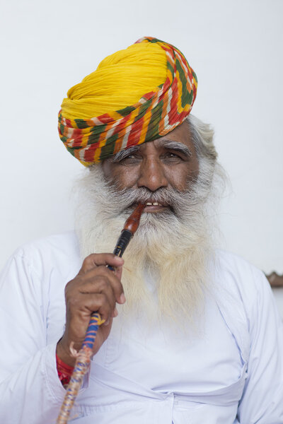Aged typical Indian Man smoking