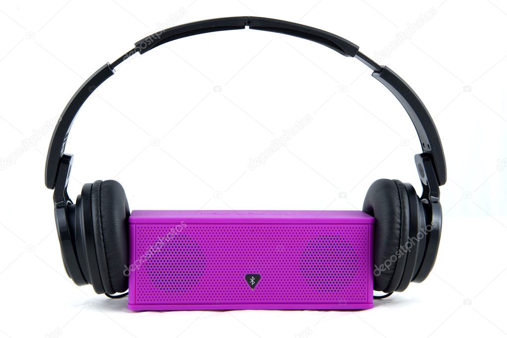 Headphones and Loudspeaker on a white background