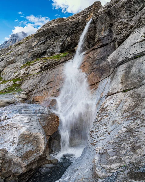 Waterfall coming from the glacier of Eiger, Bernese Alps, Switzerland