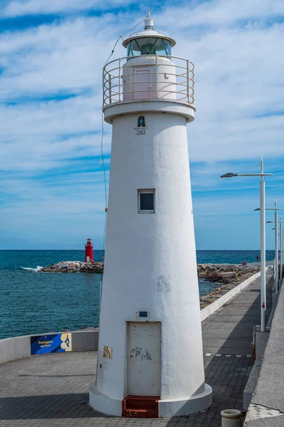 White Lighthouse in the port of Porto Maurizio, Imperia in the Italian Riviera