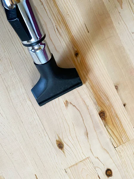 vacuum cleaner cleaning laminate floor.